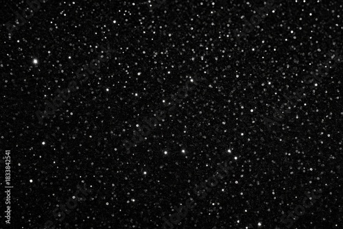 Black glitter festive background texture.