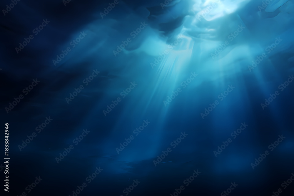 Fototapeta premium Serene underwater scene featuring soft, ethereal beams of light penetrating the deep blue ocean, creating a tranquil and mystical atmosphere