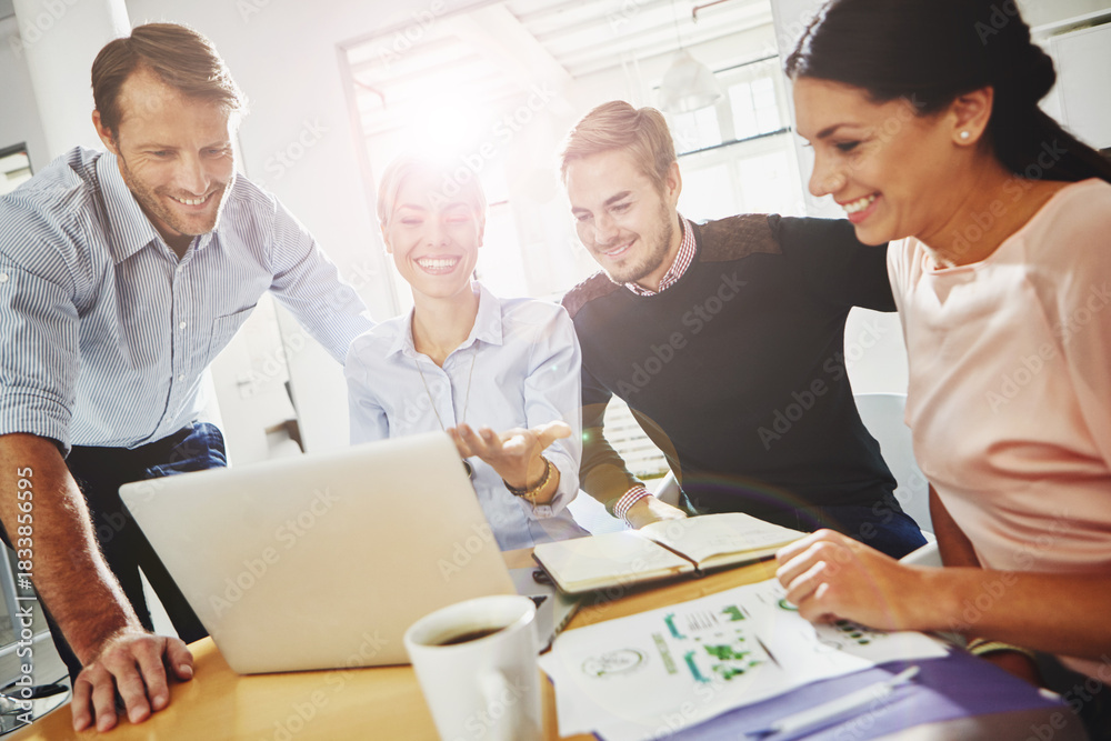 Obraz premium Collaboration, laptop and smile with financial team at desk in office for accounting or budget. Computer, documents and flare with finance people in workplace for review of business or data charts