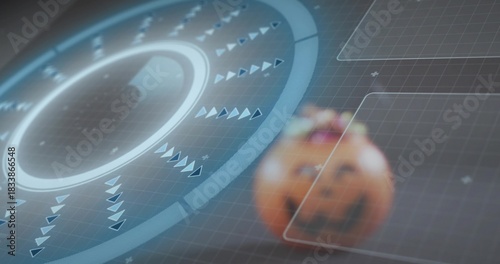 Showing circular HUD glowing with rings and spinning arrows in virtual grid with carved pumpkin