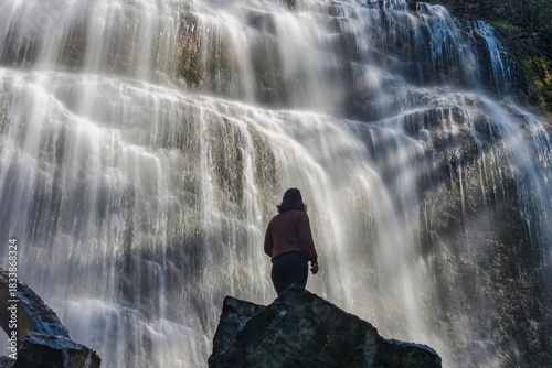 Woman admiring the powerful cascade of Bridal Veil Falls