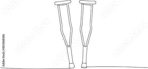 Two medical crutches standing upright on a white background