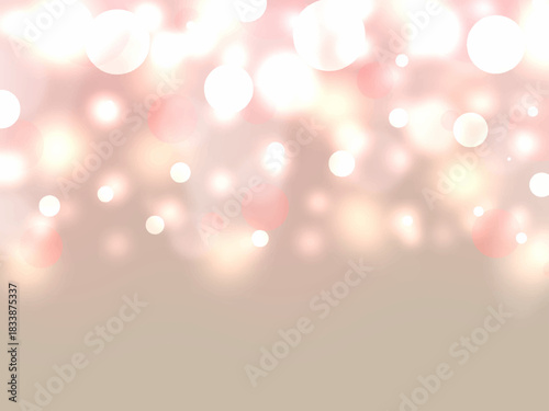 ピンク色の光の玉がキラキラ輝く美しい背景
