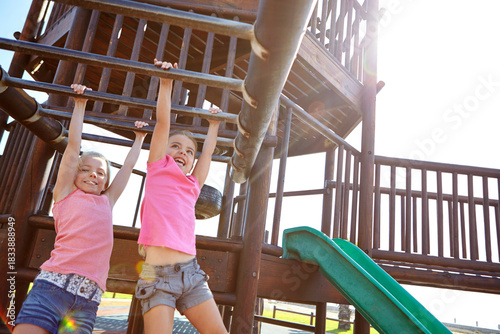 Foto Happy girl, friends or hanging with monkey bars for playful childhood or fun outdoor summer