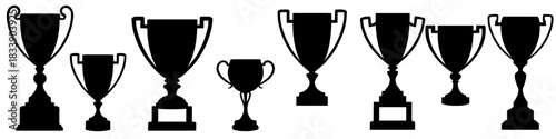collection of black trophy silhouettes in varying shapes and sizes, symbolizing success and achievement