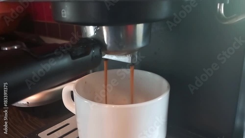 Espresso machine starts brewing with sounds of switch click, pump hum, and liquid flow from portafilter to cup