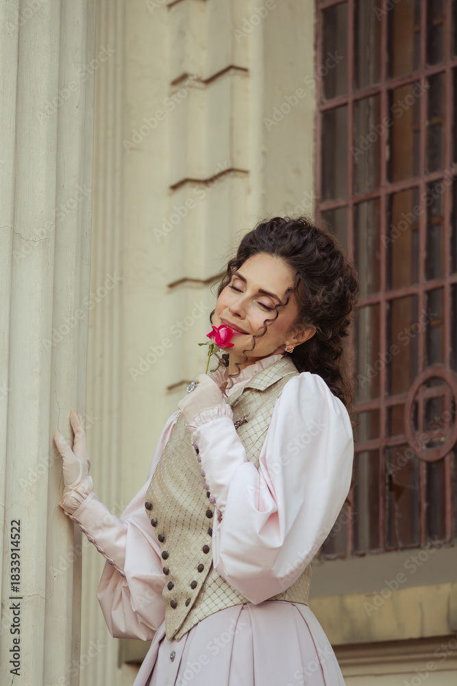 Naklejka premium Woman with a rose in an old building