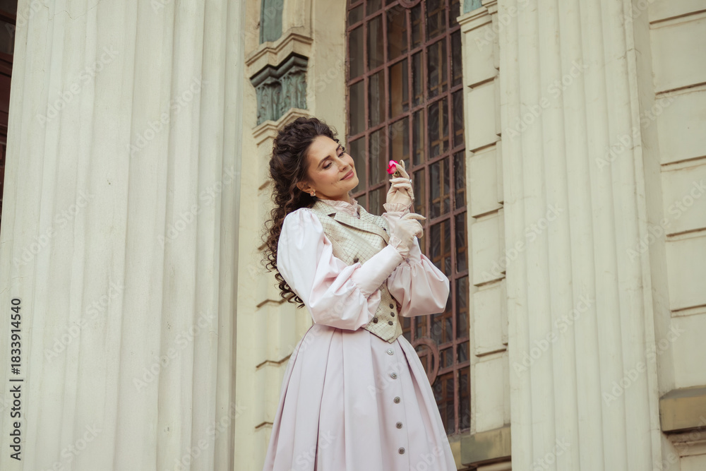Obraz premium Woman with a rose in an old building