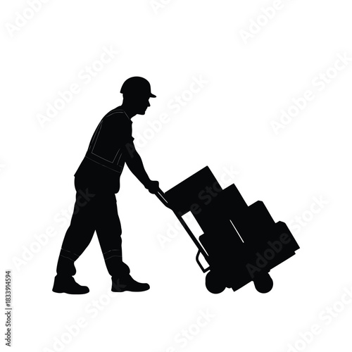 Silhouette of worker pushing hand truck loaded with box cargo