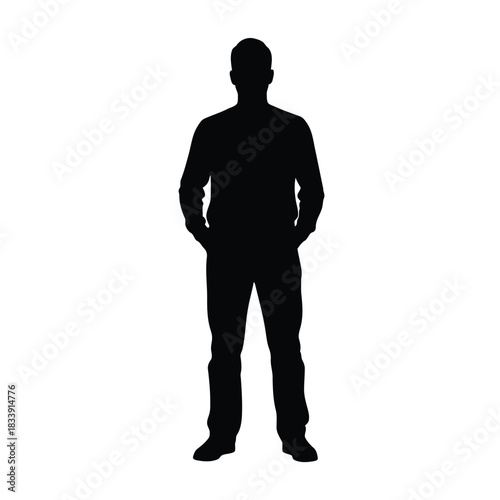 Silhouette of a man standing with hands in pocket