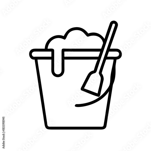 Bucket filled with sand and shovel for beach play activities  