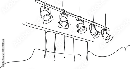 Black line drawing of stage spotlights and abstract shapes