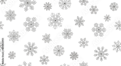 A seamless black and white background pattern featuring delicate and intricate line art snowflakes of various shapes and sizes.
