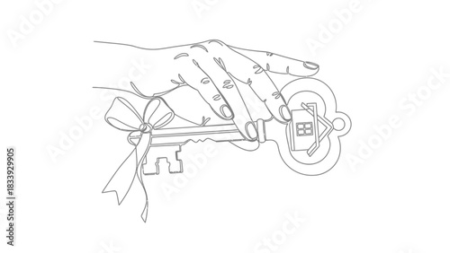 Hand holding house key with ribbon for new home purchase celebration