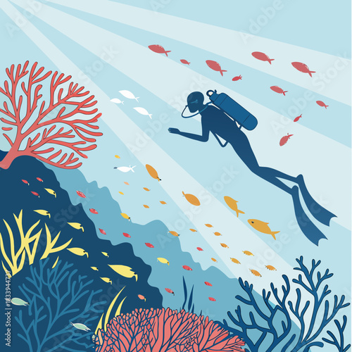 Scuba diver swimming among coral reef and fish