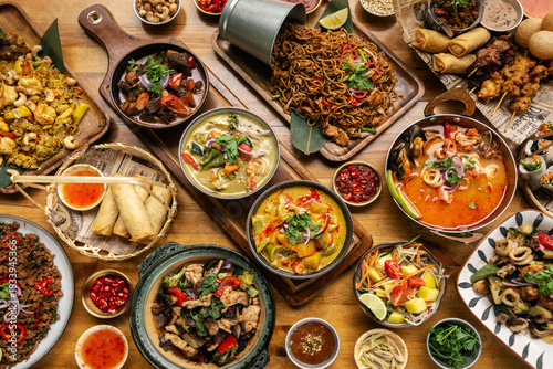 many different thai food dishes on table in modern restaurant in bangkok thailand