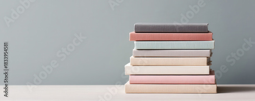 Vintage books and papers collection on a minimalist table modern interior still life conceptual art