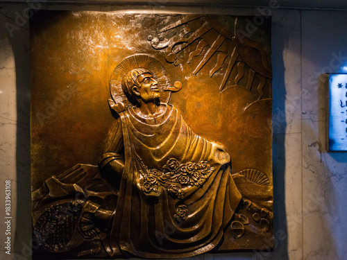 Bronze relief of Saint Juan Diego receiving the revelation of the Virgin Mary. Basilica of Our Lady of Guadalupe, Mexico City.