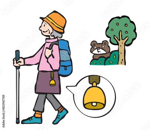 熊よけの鈴をつけて山登りをする女性（シニア）