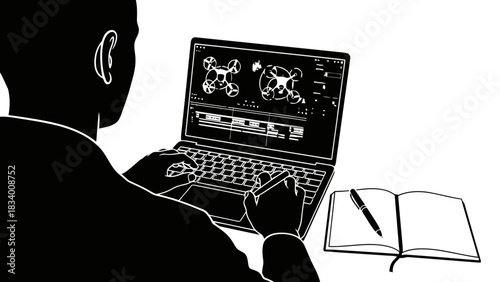 Person editing drone footage on a laptop with a notebook and pen