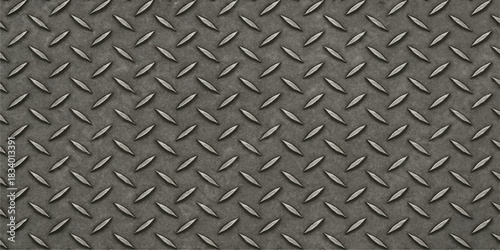 Seamless industrial diamond plate texture featuring a metallic silver steel pattern on a hard grey aluminum sheet surface for construction and heavy industry design
