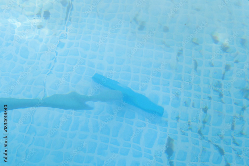 Fototapeta premium framed pool brushing on sunny. Contaminated pool cleaning concept