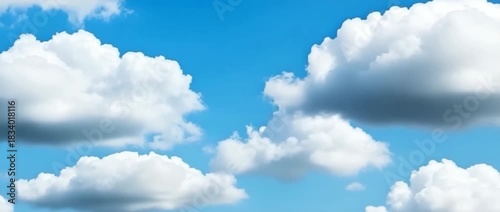Bright blue summer sky features large scattered formations of fluffy white cumulus clouds Deep blue background with natural cloud patterns and shadows