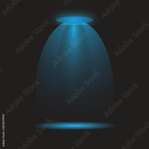 Powerful blue spotlight beam illuminates dark empty stage floor from above.