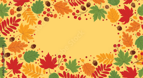Autumnal background forming a frame of colorful fall leaves, acorns, and berries with a blank oval space in the center for text.
