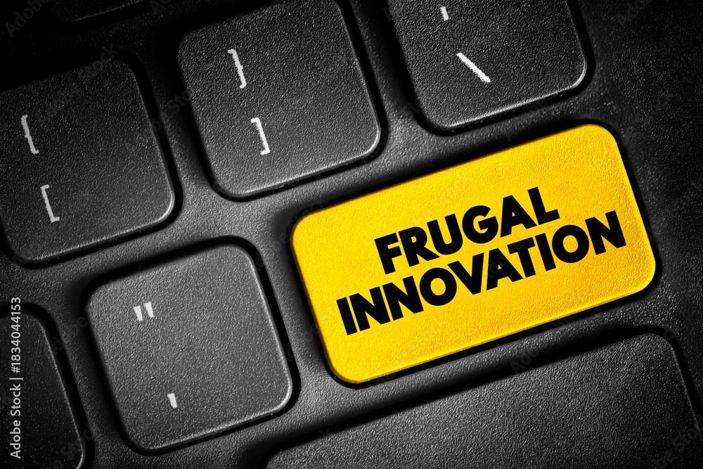 Fototapeta premium Frugal Innovation is the process of reducing the complexity and cost of a good and its production, text button on keyboard, concept background