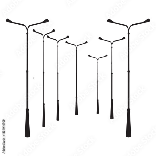 This image depicts a collection of black, stylized streetlights silhouetted against a white background. The lights vary in height and have a distinctive Y-shaped arm at the top, designed to hold lamps