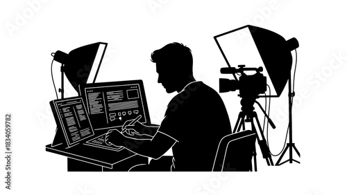 Silhouette of a content creator working with a camera and computer setup