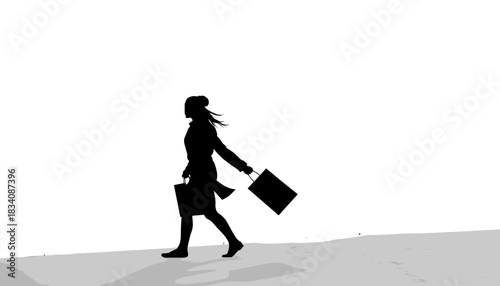 Businesswoman walking with briefcase against white background  