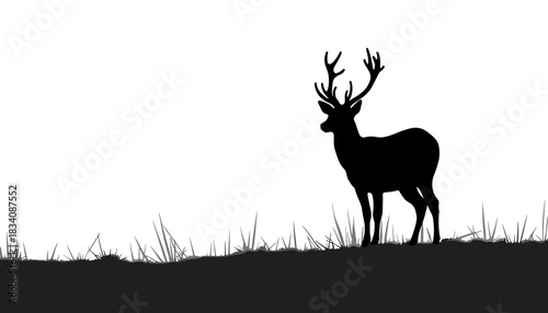 Silhouette of deer standing on grass at dusk in minimal style  