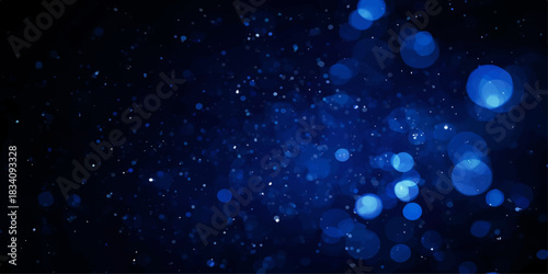 Abstract blue galaxy particles in motion creating a starry night sky background for a cold winter holiday design
