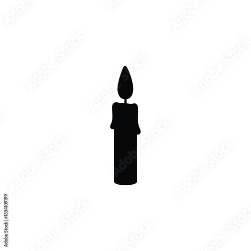 A single black candle burning with a flame silhouette