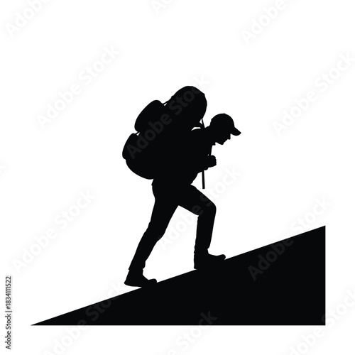 Silhouette of a hiker climbing a steep hill with backpack and trekking pole silhouette