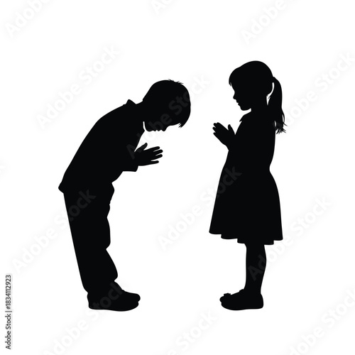 Two children bowing to each other in a silhouette