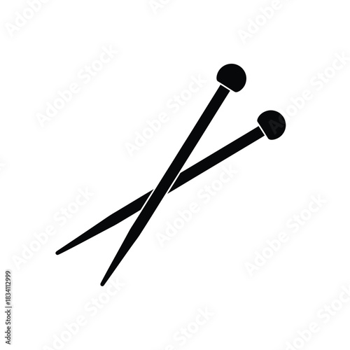 Two crossed knitting needles silhouette
