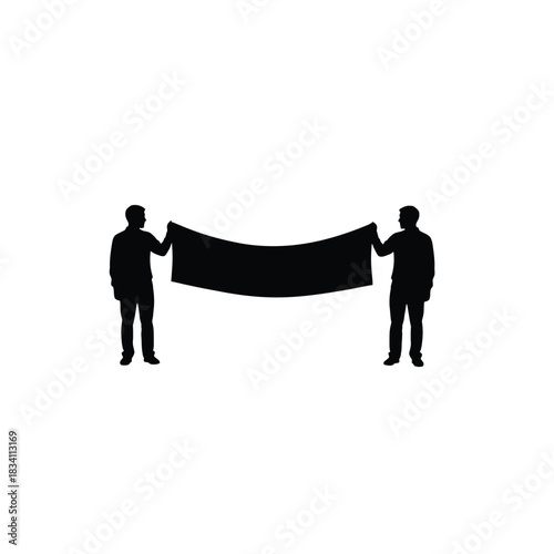 Two people holding a large black banner silhouette