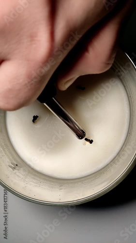 A man lights a triple holiday candle with a lighter