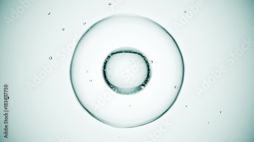 Macro of drops of liquid moving inside bubbles. Skin care serum droplets uniting into one. Cosmetics moisturizer fluid concept. Looping animation