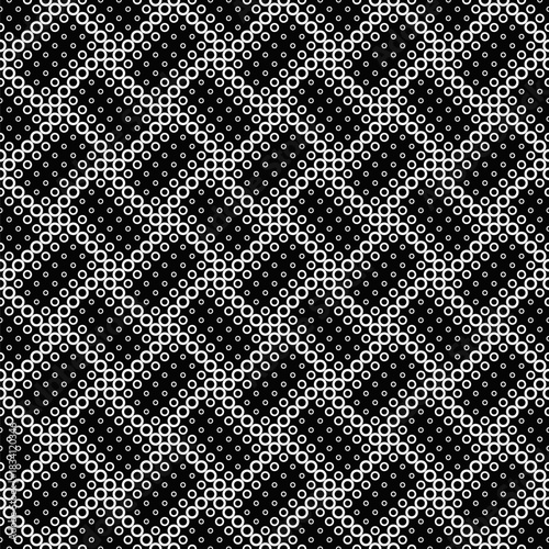 Geometrical seamless monochrome circle pattern background - abstract vector graphic design from rings