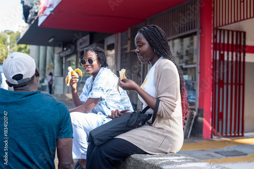Two beautiful african girls taking a tour in the city