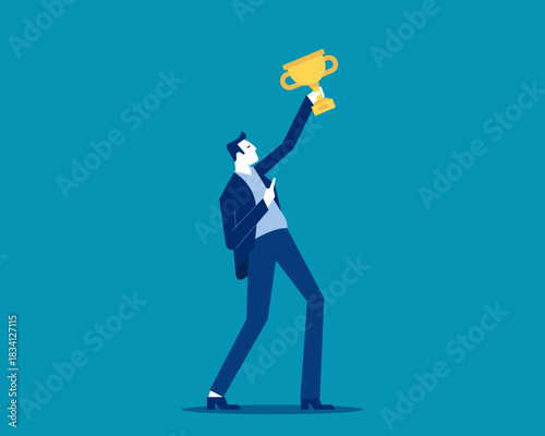 Successful. Businessman in formal wear holding gold cup