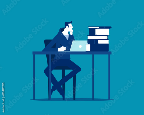 Thinking. Man sit in thoughtful pose at working desk with books.