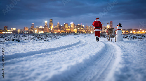 Santa Claus with a bag of gifts, a reindeer, and a snowman walk on snow towards the glowing city skyline