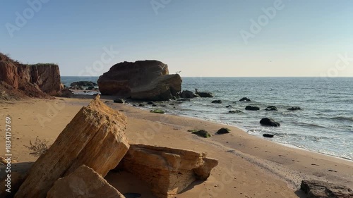 Wild Coastline with Yellow Rocks on Black Sea in sunny day