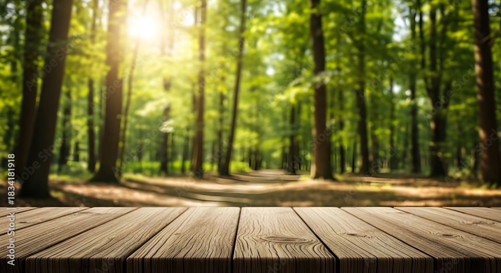Fototapeta premium Wooden table with defocused forest background and sunlight burst