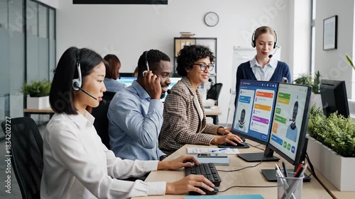 Diverse team of call center agents working together in a modern office environment.